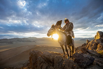 A Kazakh Eagle Hunter with his eagle from Altantsögts district of Bayan-Ölgii Province in western Mongolia