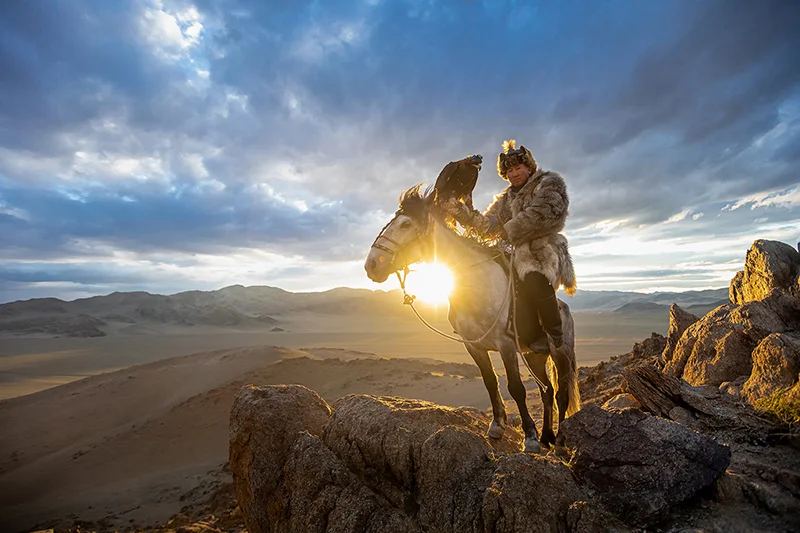 A Kazakh Eagle Hunter with his eagle from Altantsögts district of Bayan-Ölgii Province in western Mongolia.