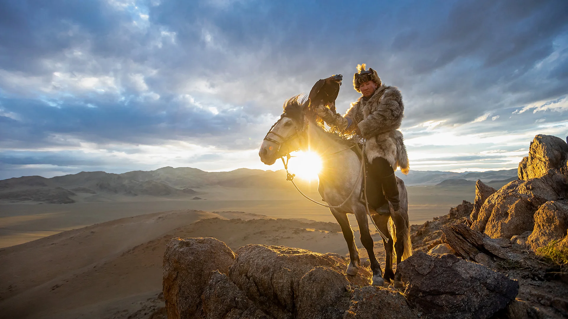 A Kazakh Eagle Hunter with his eagle from Altantsögts district of Bayan-Ölgii Province in western Mongolia A Kazakh Eagle Hunter with his eagle from Altantsögts district of Bayan-Ölgii Province in western Mongolia