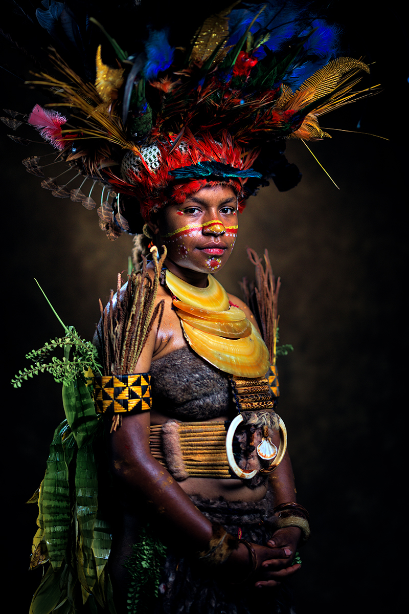 Young Kuman woman wearing traditional ceremonial attire prepared for a marriage ceremony in the Chimbu Highlands, Papua New Guinea.