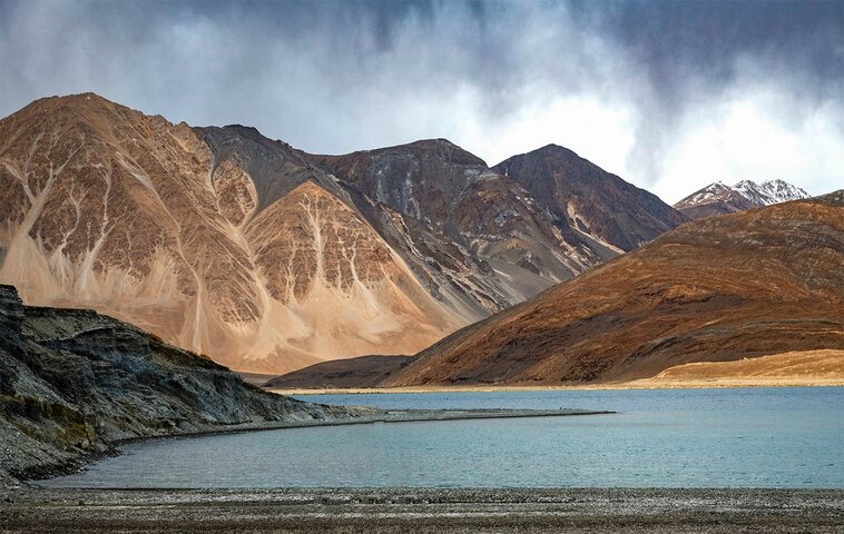 Botei Rys, a Kazakh Eagle Hunter crossing a river with his eagle from Altantsögts district of Bayan-Ölgii Province in western Mongolia.
